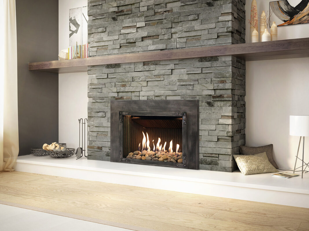 The Inspiration® 34 Gas Fireplace Insert with stacked stones surround.