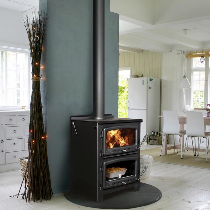Modern open-concept living space with Nectre N550 wood-burning cookstove combining heating and cooking functionality.